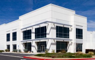 White commercial building with grey accent