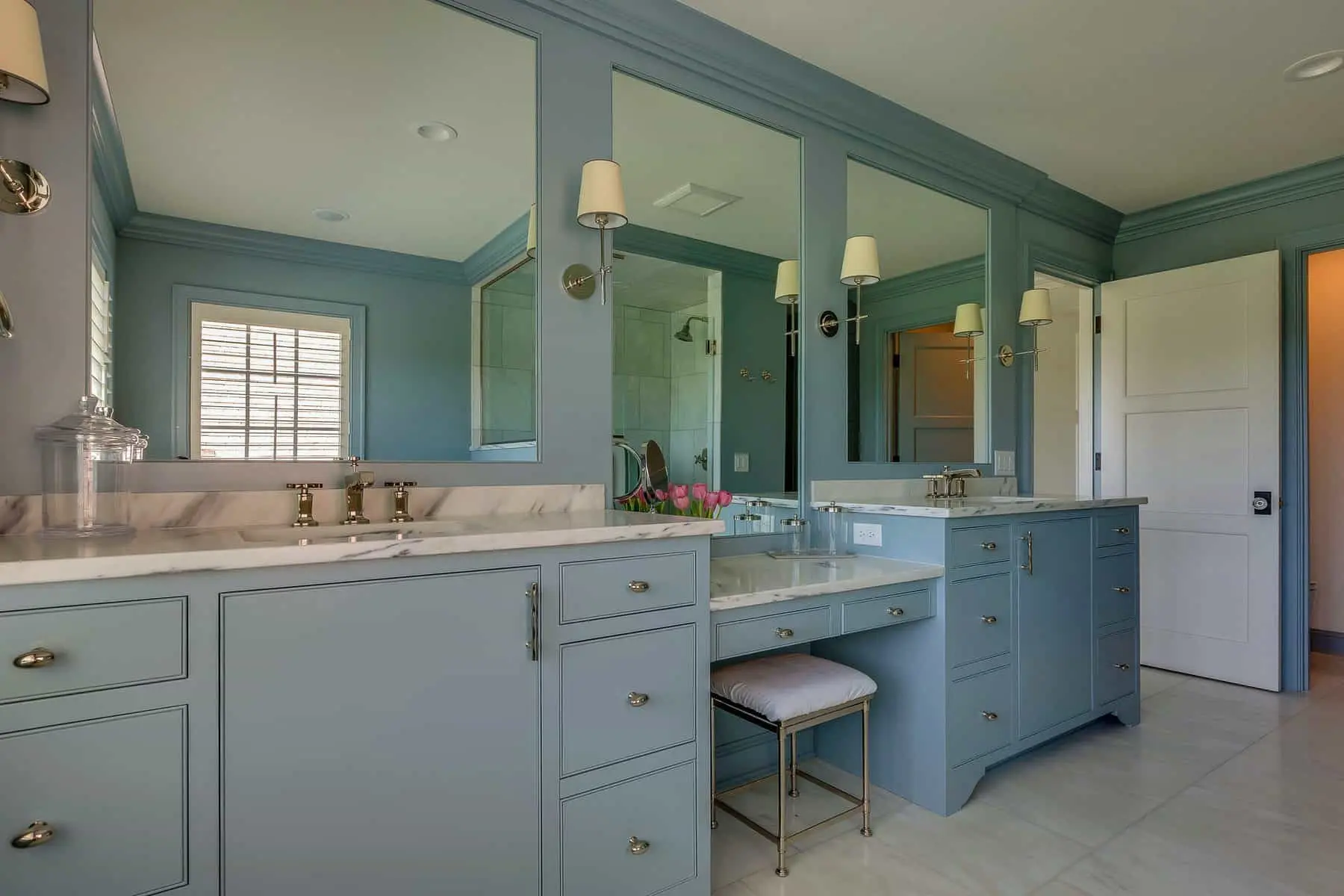 cabinet painting vs replacement Florida. Bluish grey vanity with cream marble top is one of the best cabinet paint color combination